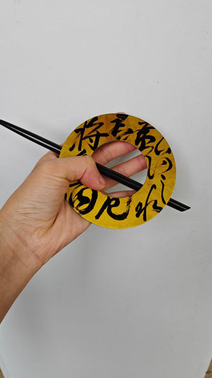 Chinese calligraphy hairpin, ebony wood, handmade hairpin with natural Chinese lacquer; front hand holding