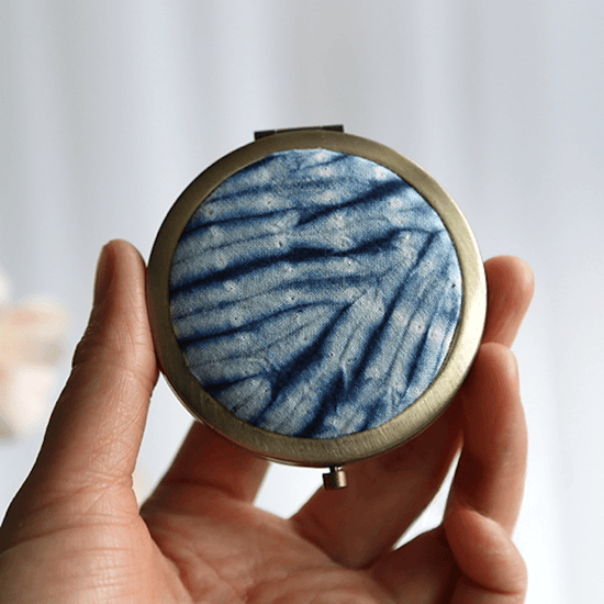 handmade_tie-dye_pocket_mirror_curved_broken_glass_hand_holding